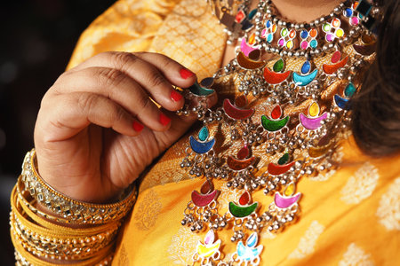 Colorful traditional jewelry displayed during festive celebrationの写真素材