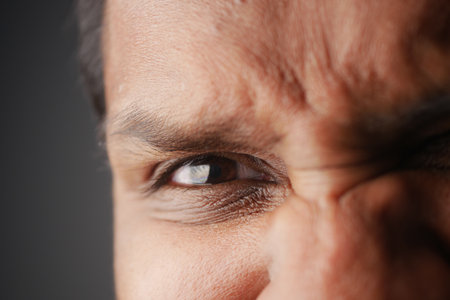 Expressions of intensity captured in a close-up portrait of a manの写真素材