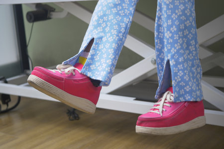 child with cerebral palsy leg brace and a special shoeの写真素材