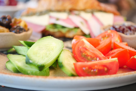 Delicious salad and sandwich platter on a dining tableの写真素材