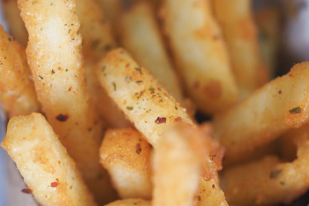 Golden crispy fries served in a casual dining settingの写真素材