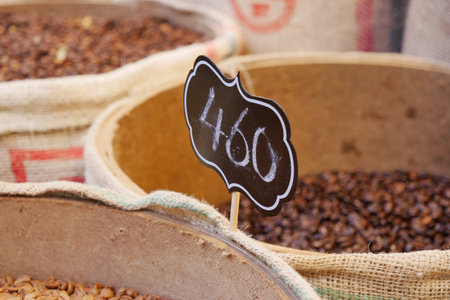 Colorful display of spices with numbered sign at local marketの写真素材