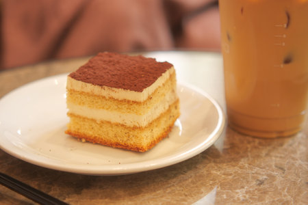 Delicious dessert served with coffee at a cozy cafe settingの写真素材
