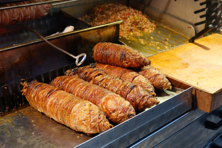 Grilled Lamb Offal Street Food Displayed on a Hot Grill for Cookingの写真素材