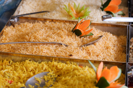 Colorful rice varieties displayed at a festive food stallの写真素材