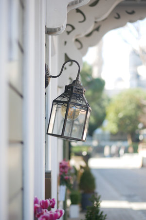 Elegant street lamp illuminating a charming walkway in the cityの写真素材
