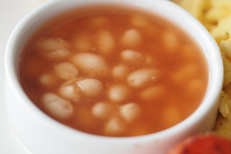 Delicious bowl of white beans served with savory riceの写真素材