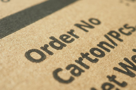 Delivery order details displayed on a carton in close-up shotの写真素材