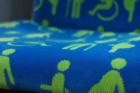 Patterns of accessibility symbols on a blue fabric surfaceの写真素材