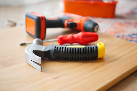 Essential tools for home improvement on wooden surfaceの写真素材