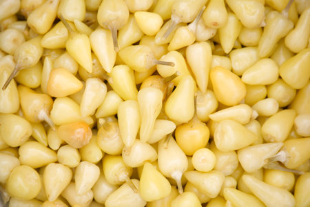 Close-Up of Fresh Yellow Chili Peppers in a Pileの写真素材