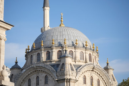 Dome of historical mosque shines under clear blue skyの写真素材