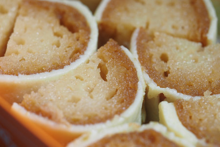 indian sweet dessert rolls served on a wooden platterの写真素材