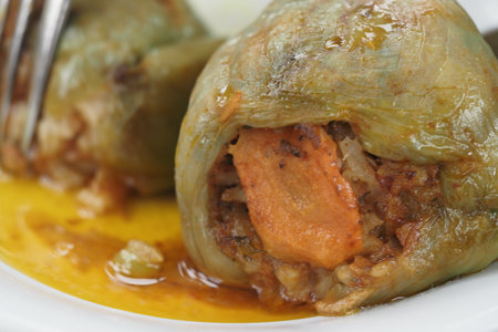 Traditional stuffed peppers with savory filling at a local marketの写真素材
