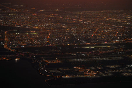 City skyline illuminated at night from above with bright lightsの写真素材
