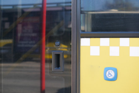 City bus entrance with accessibility features and clear signageの写真素材