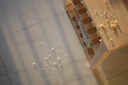 Wood shavings scattered on the floor after crafting session indoorsの写真素材