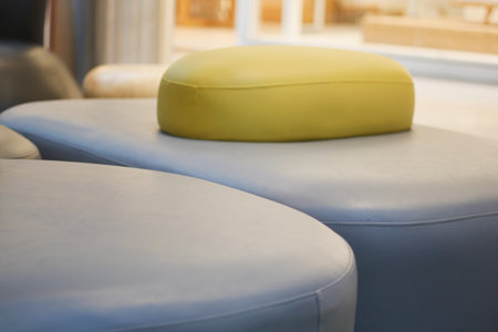 Comfortable seating arrangement featuring colorful cushionsの写真素材