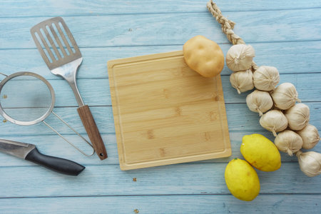 Cooking preparation with fresh ingredients on a wooden boardの写真素材
