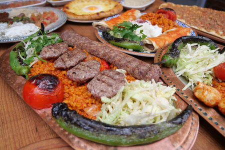 Delicious platter of grilled meats and rice served at a local eateryの写真素材