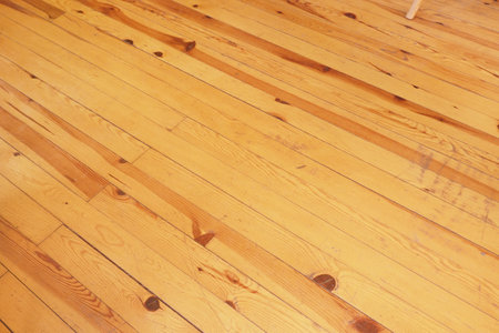 Polished hardwood floor highlights natural grain patternsの写真素材