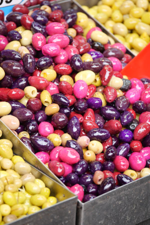 Colorful assortment of olives displayed at local market stallの写真素材
