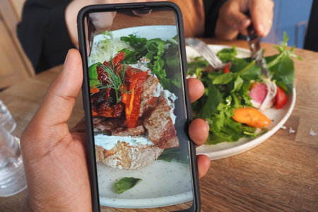 Capturing a delicious meal at a cozy cafe during brunchの写真素材