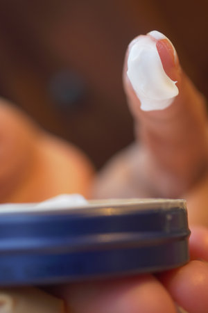 Moisturizing cream application on fingertip in close-up viewの写真素材