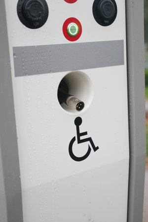Accessible charging station with disability symbol at public location