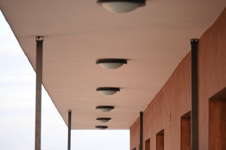 Unique lighting fixtures on a modern buildings ceilingの写真素材