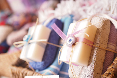 Handmade soap displayed in a market basket with vibrant textiles