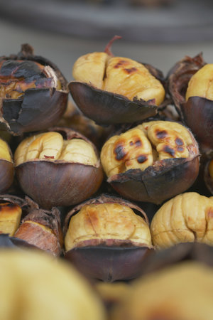 Roasted chestnuts served at a street market during autumn seasonの写真素材