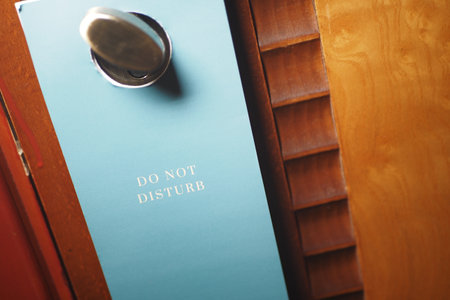 Do not disturb sign hanging on a hotel doorの写真素材
