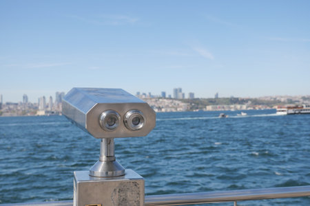 Binoculars overlooking the waterfront in Istanbul during a clear dayの写真素材