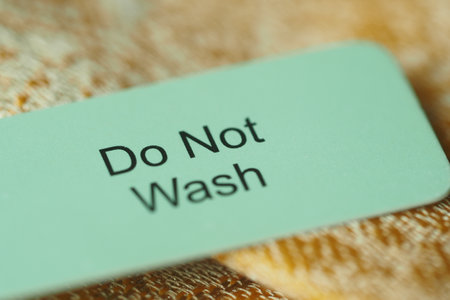 Important washing instruction label on a fabric itemの写真素材