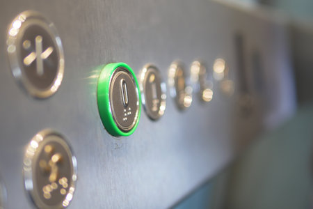 Elevator control panel with illuminated button in modern buildingの写真素材