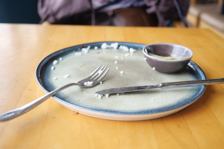 Empty plate after a satisfying meal at a cozy restaurant