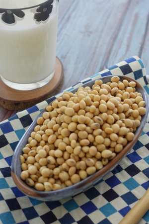 Healthy soybeans served in a traditional bowl on a checkered clothの写真素材