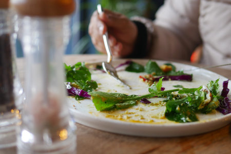 Leftover salad on a plate at a casual dining restaurant