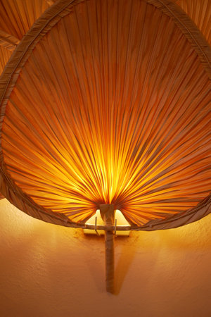 Soft glow radiating from unique artisanal light fixtureの写真素材