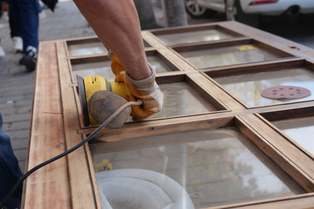 Wooden surface being sanded in a city settingの写真素材