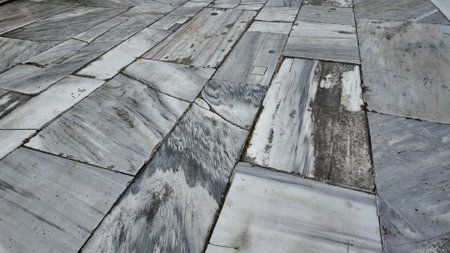 Unique gray stone pavement with varied textures and patternsの写真素材
