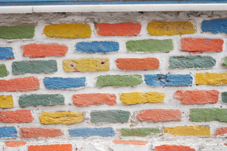 Colorful urban brick wall features artistic designの写真素材