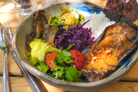 Delicious bowl of vibrant food featuring rice and vegetablesの写真素材