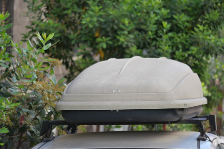 Car roof box for travel parked in residential areaの写真素材