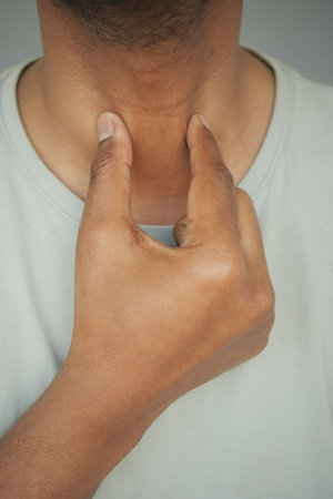 Checking pulse on neck in a calm setting indoors