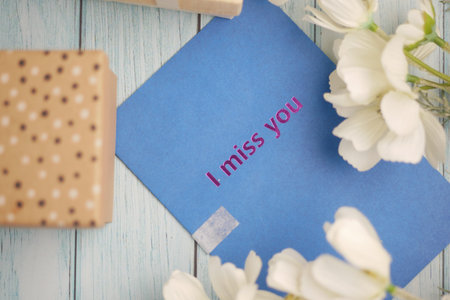 Messages written on colorful cards placed among flowersの写真素材