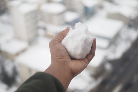 Winter wonderland snowball in a city settingの写真素材