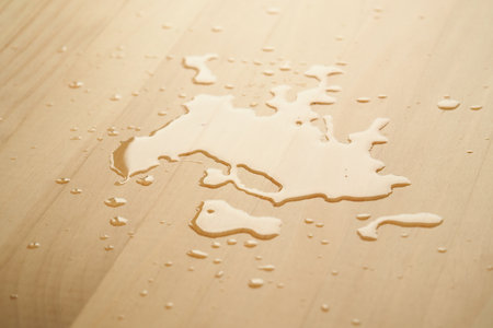 Water droplets create patterns on wooden surfaceの写真素材