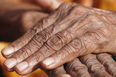 Wrinkled hands show times passageの写真素材